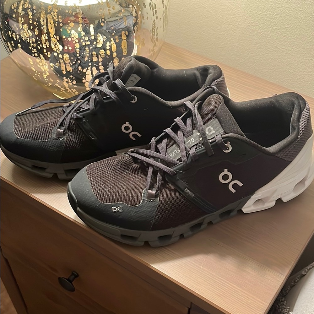 On Running Black and White Athletic Shoes with Lace-Up Closure